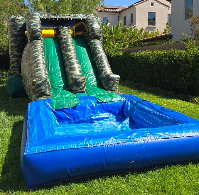 Camouflage-themed combo bounce house with jumping and play areas