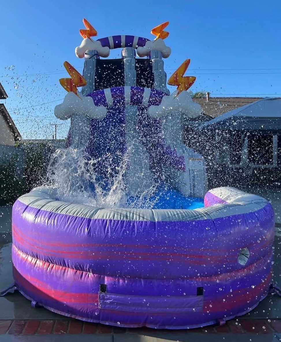 Lightning-themed water slide inflatable from different angle for party rentals