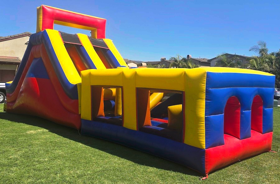 Inflatable obstacle course featuring climbing and crawling sections