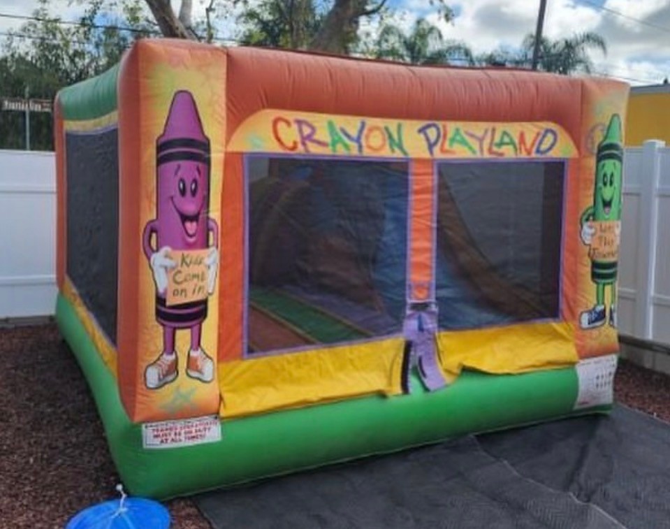 Crayon playland themed bounce house jumper with creative design details.